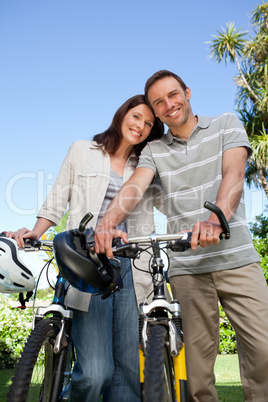 Joyful couple with their bikes