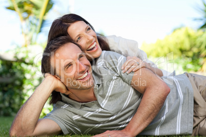 Couple lying down in the garden