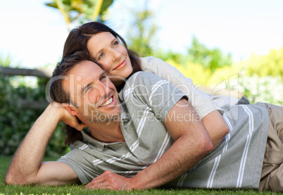 Couple lying down in the garden