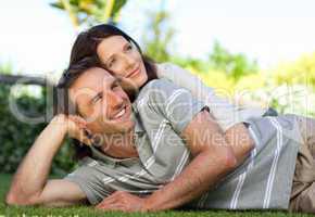 Couple lying down in the garden