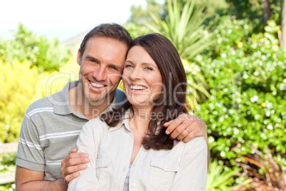 Beautiful woman with her husband in the garden