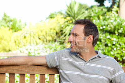 Portrait of a man sitting on a  bench