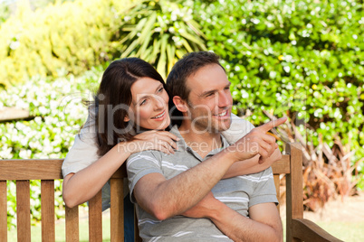 Glad couple hugging in the garden