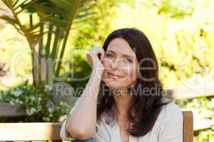 Portrait of a pretty woman in the garden