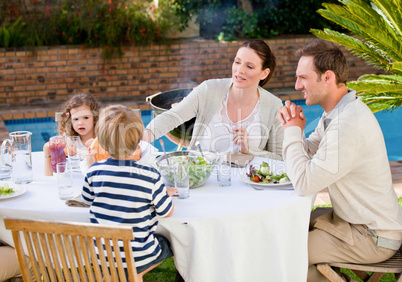 Family eating in the garden