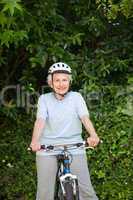 Mature woman mountain biking outside