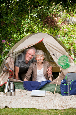 Happy couple camping in the garden