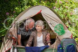 Happy couple camping in the garden
