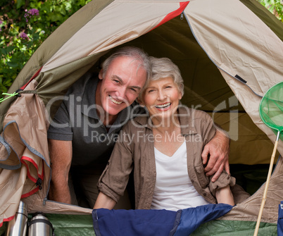 Happy couple camping in the garden