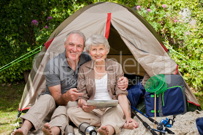 Happy couple camping in the garden