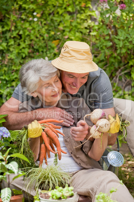Man hugging his woman in the garden