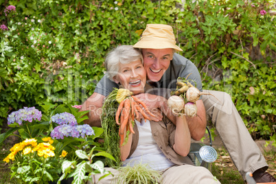 Man hugging his woman in the garden
