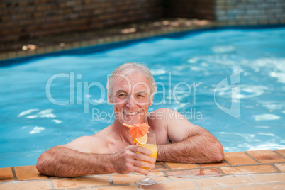 Senior man in his swimming pool