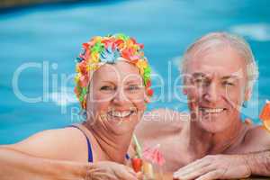 Happy mature couple in the swimming pool