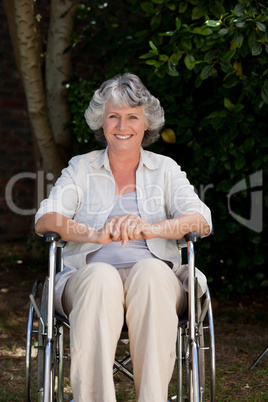 Smiling woman in her wheelchair