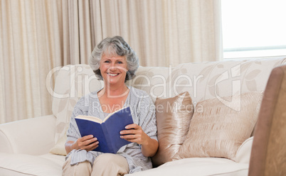Senior woman reading her book