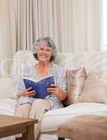 Senior woman reading her book