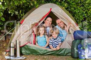 Joyful family camping in the garden
