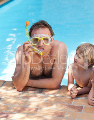 Father with his son in the swimming pool