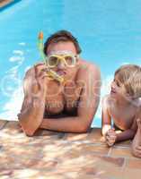 Father with his son in the swimming pool