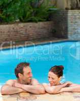 Lovely couple  in the swimming pool