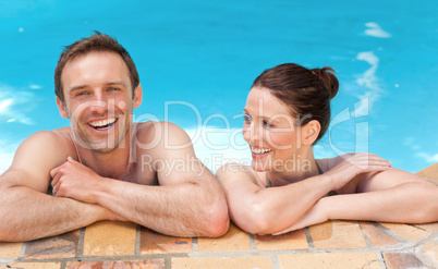 Lovely couple  in the swimming pool