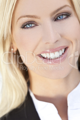 Portrait of Beautiful Happy Young Blond Woman With Blue Eyes