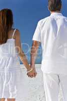 Couple Holding Hands on An Empty Beach