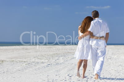 Couple Walking on An Empty Beach