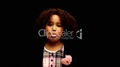 Young black girl/child with curly hair talking to camera  3