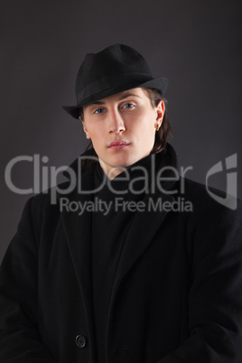 Man in black cloth and hat