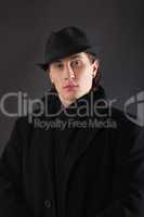 Man in black cloth and hat