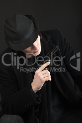 Man with gun and black hat