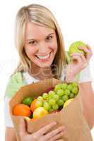 Healthy lifestyle - cheerful woman with fruit shopping bag