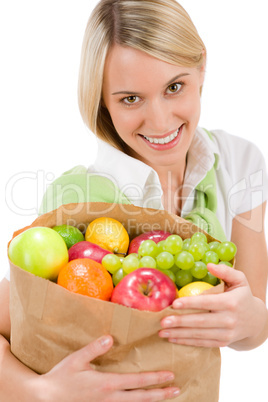 Healthy lifestyle - woman with fruit shopping paper bag