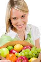 Healthy lifestyle - woman with fruit shopping paper bag