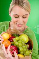 Healthy lifestyle - woman with fruit shopping paper bag