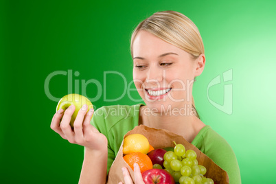 Healthy lifestyle - woman with fruit shopping paper bag