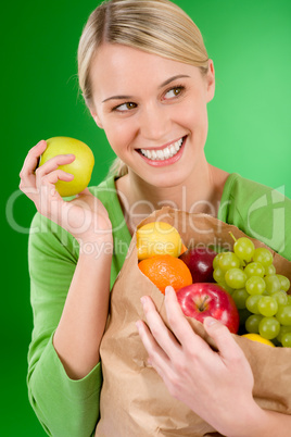 Healthy lifestyle - woman with fruit shopping paper bag