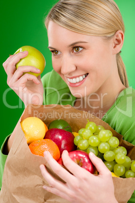 Healthy lifestyle - woman with fruit shopping paper bag