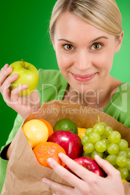 Healthy lifestyle - woman with fruit shopping paper bag