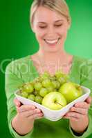 Healthy lifestyle - woman holding bowl with fruit