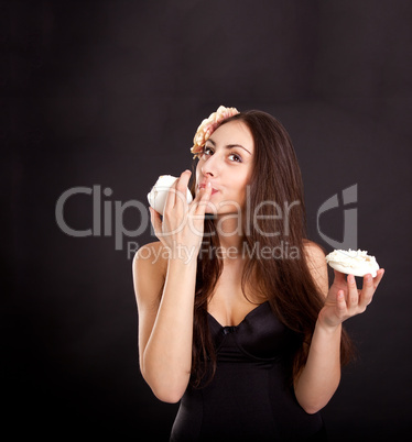 Pretty young girl eating cake