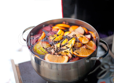 Casserole with hot wine, fruits and spices