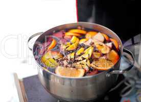 Casserole with hot wine, fruits and spices