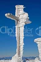 frozen cross on mountain summit