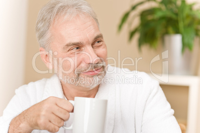 Senior mature man - breakfast coffee at home