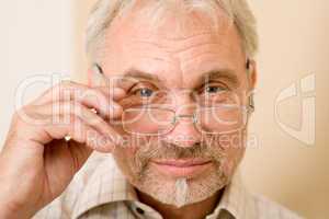 Senior mature man thoughtful with glasses