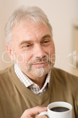 Senior mature man having coffee break