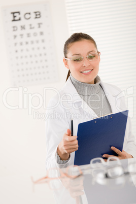 Optician doctor woman with glasses and eye chart